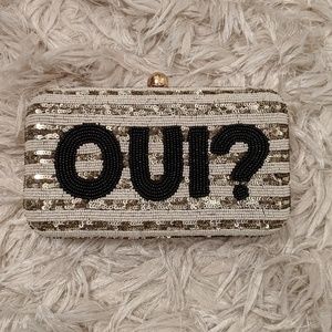 Gold statement clutch "Oui?" French